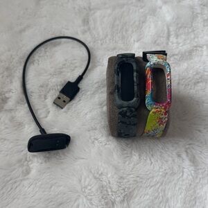 Fitbit Ace 3 Activity Tracker with charging cable and spare band